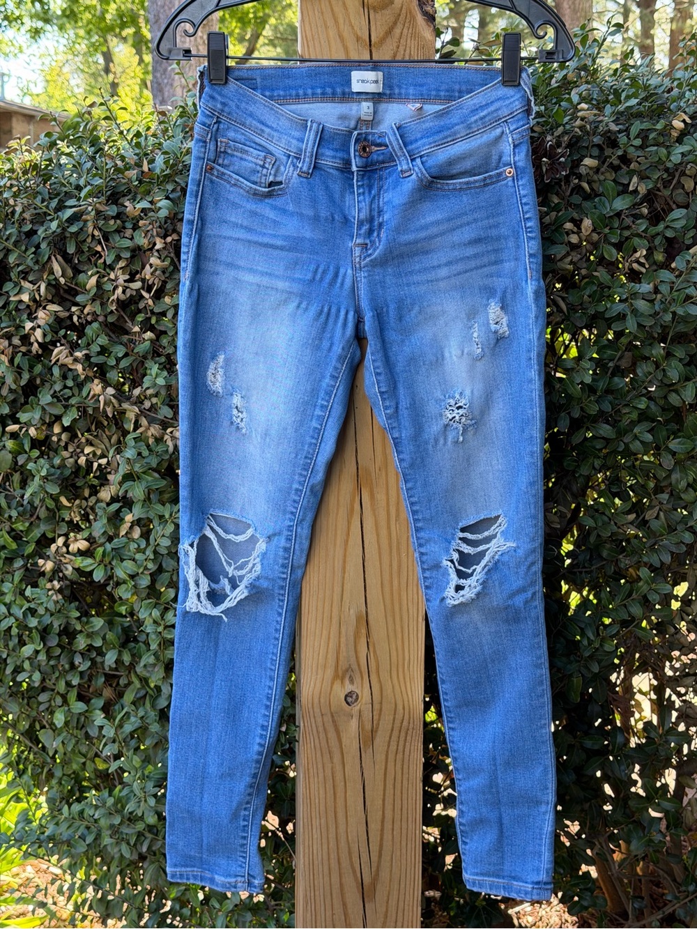 Sneak Peek Distressed Light Blue Skinny Jeans